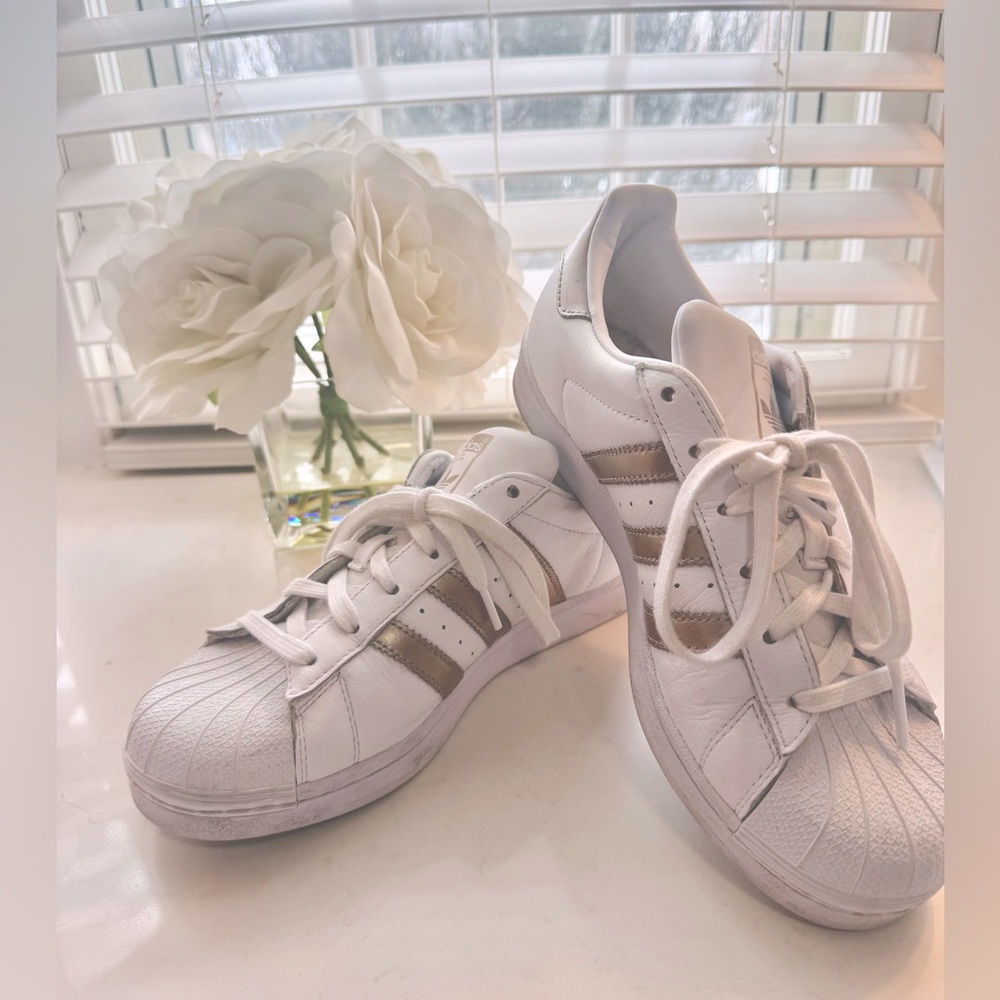 Gold/bronze and white Adidas Superstars 🤎🤍